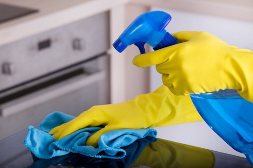 Carpet cleaning technician preparing equipment safely indoors
