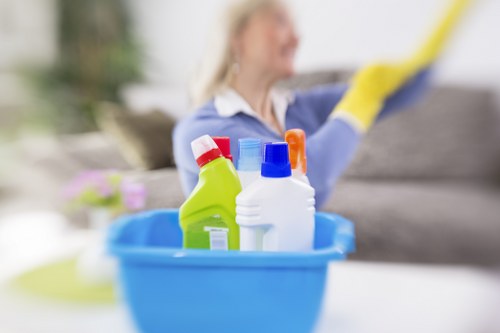 Carpets cleaner in Chiswick using deep cleaning equipment on hallway flooring